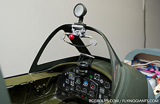 The cockpit latch, rear-view mirror mounted and instrument panel background repainted.